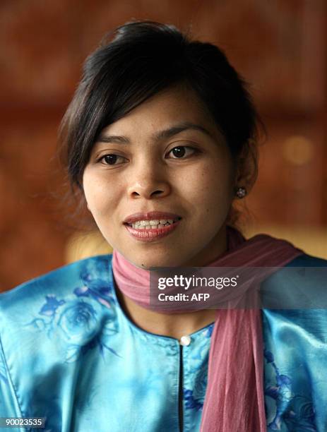 Malaysia-Islam-religion-crime-Singapore BY M. JEGATHESAN Muslim model Kartika Sari Dewi Shukarno listens during an interview with AFP at her father's...