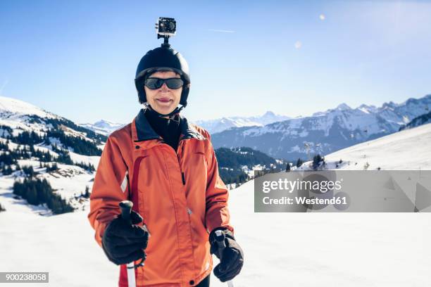 austria, damuels, skier with action cam in winter landscape - action camera stock pictures, royalty-free photos & images