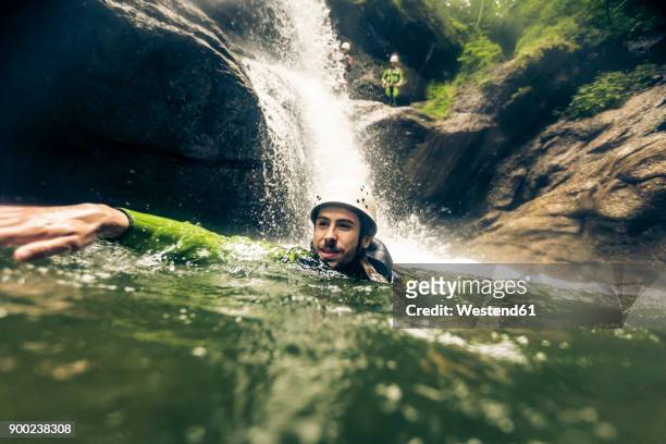 germany, bavaria, allgaeu, man canyoning in ostertal - canyoning stock pictures, royalty-free photos & images