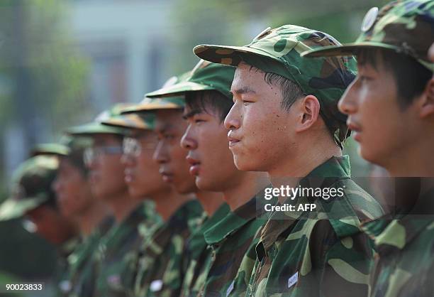 This photo taken on August 22, 2009 shows Chinese first-year college students undergoing a one-month military training at a camp prior to their first...