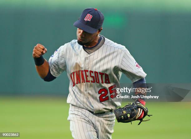 Second baseman Alexi Casilla of the Minnesota Twins celebrates after making a play in a game against the Kansas City Royals at Kauffman Stadium on...
