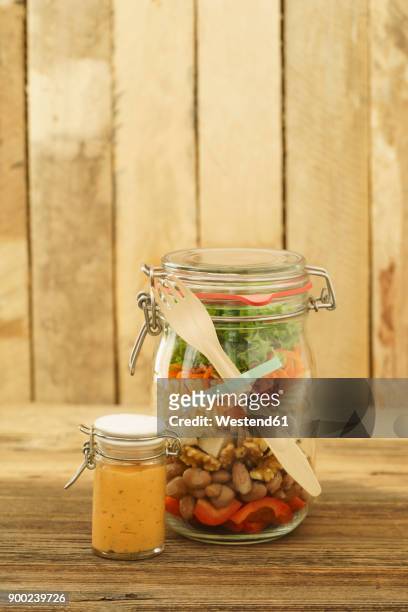 preserving jar of vegan mixed salad with tofu and pasta and jar of cocktail sauce - soy dressing stock pictures, royalty-free photos & images