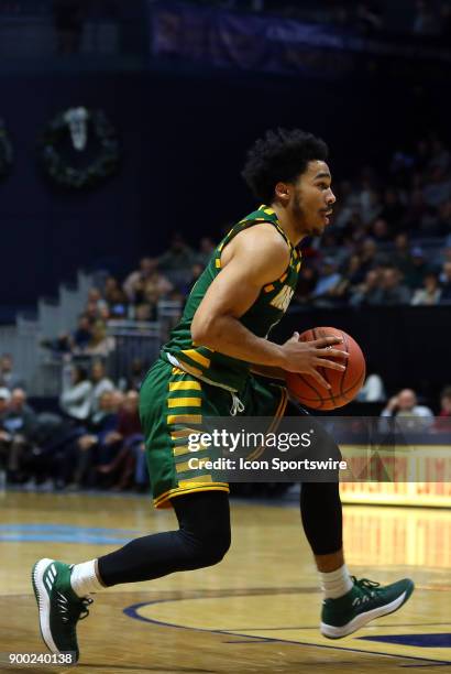 George Mason Patriots guard Otis Livingston II drives to the basket during a college basketball game between George Mason Patriots and Rhode Island...