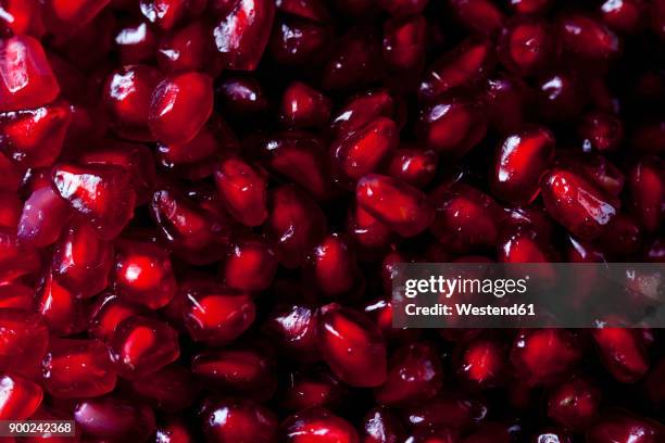 pomegranate seeds, close-up - pomegranate juice stock pictures, royalty-free photos & images