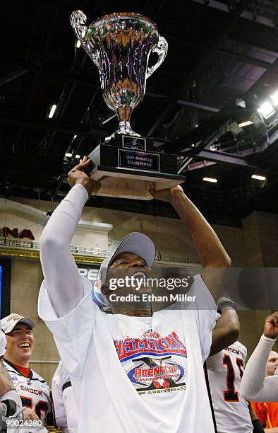 Sergio Gilliam of the Spokane Shock holds up the trophy after the Shock defeated the Wilkes-Barre/Scranton Pioneers 74-27 in the AFL2 ArenaCup 10 at...