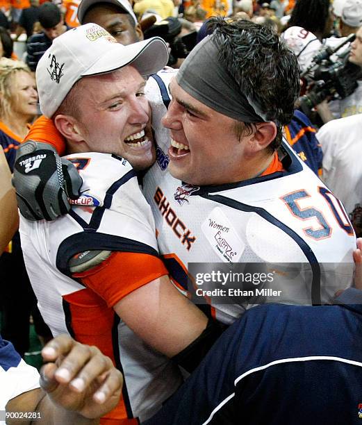 Andy Olson and Kevin McCullough of the Spokane Shock celebrate after the Shock defeated the Wilkes-Barre/Scranton Pioneers 74-27 in the AFL2 ArenaCup...