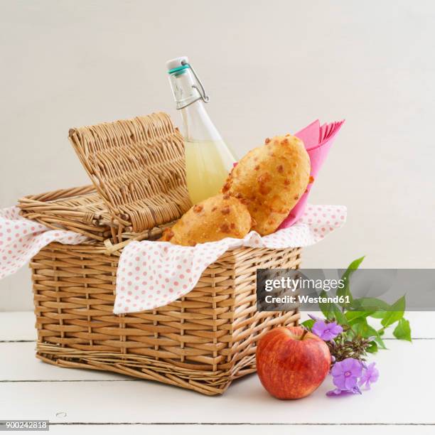picnic basket with cheese baguettes and fruit juice - picnic basket stock pictures, royalty-free photos & images