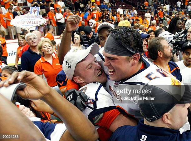 Andy Olson and Kevin McCullough of the Spokane Shock celebrate after the Shock defeated the Wilkes-Barre/Scranton Pioneers 74-27 in the AFL2 ArenaCup...