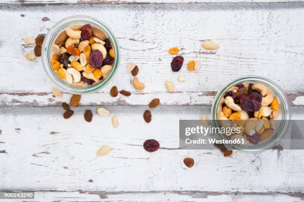 two glasses of trail mix - trail mix stock pictures, royalty-free photos & images