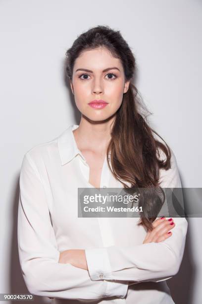 portrait of serious young woman - grey blouse stock pictures, royalty-free photos & images