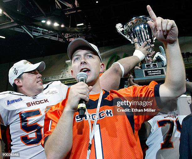 Spokane Shock owner Brady Nelson addresses the crowd in front of his player Kevin McCullough after the team's 74-27 victory over the...