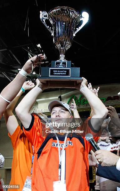 Spokane Shock owner Brady Nelson holds up the trophy after his team's 74-27 victory over the Wilkes-Barre/Scranton Pioneers in the AFL2 ArenaCup 10...