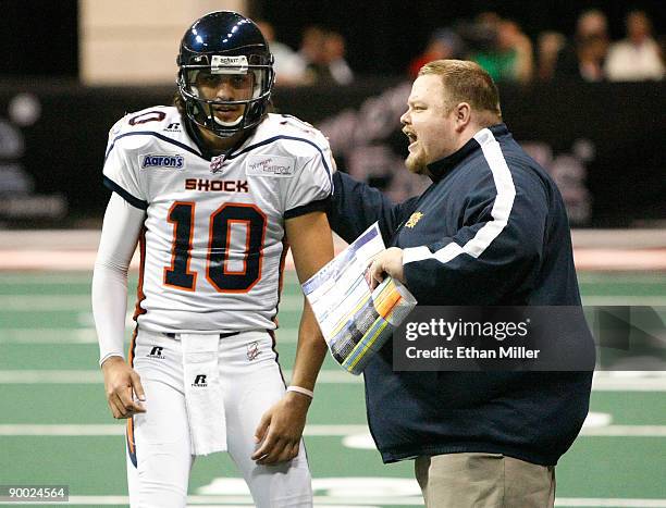Head coach Adam Shackleford of the Spokane Shock speaks to his quarterback Nick Davila during the team's 74-27 victory over the Wilkes-Barre/Scranton...