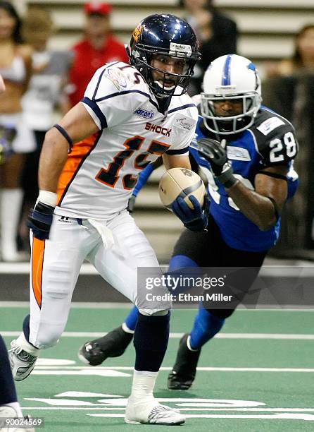 Raul Vijil of the Spokane Shock runs up the field ahead of Allan Barnes of the Wilkes-Barre/Scranton Pioneers during the AFL2 ArenaCup 10 at the...