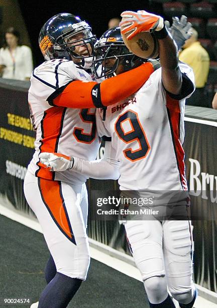 Kevin McCullough of the Spokane Shock celebrates in the end zone with Sergio Gilliam after Gilliam returned an interception for a touchdown during...