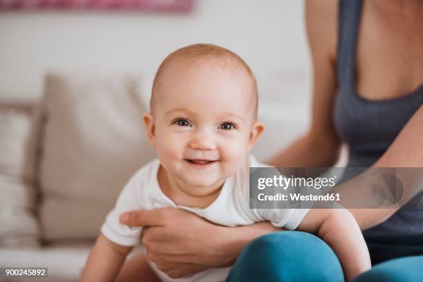 portrait of baby girl with mother at home - baby cute stock-fotos und bilder