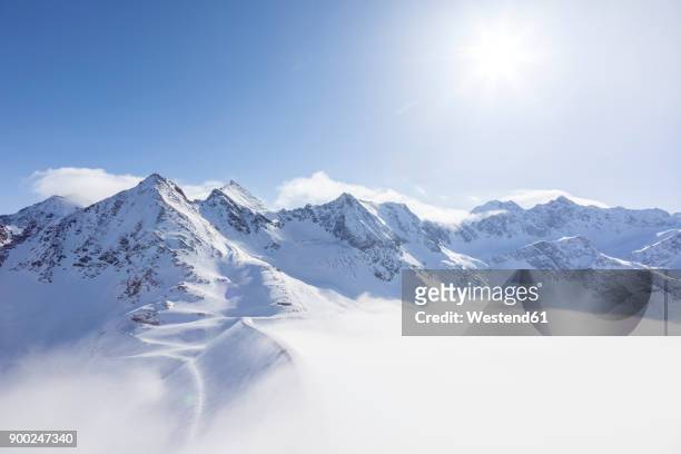 austria, kuehtai, mountainscape in winter - bergketen stockfoto's en -beelden