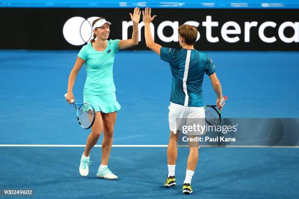 Elise Mertens and David Goffin of Belgium celebrate a point during the mixed doubles match against Alexander Zverev and Angelique Kerber of Germany...