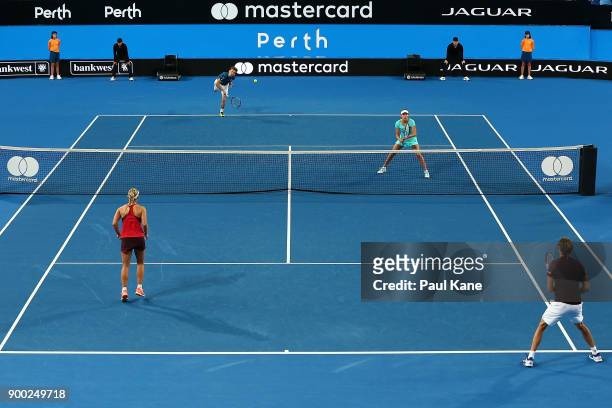 David Goffin and Elise Mertens of Belgium play Alexander Zverev and Angelique Kerber of Germany during the mixed doubles match against on day 3...