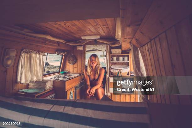 spain, tenerife, young woman sitting in van - portrait of a camper stock pictures, royalty-free photos & images