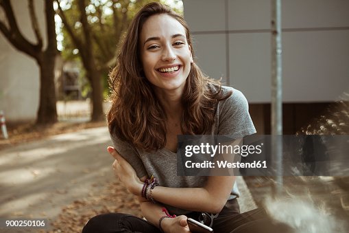 Portrait of happy young woman outdoors Portrait of happy young woman outdoors