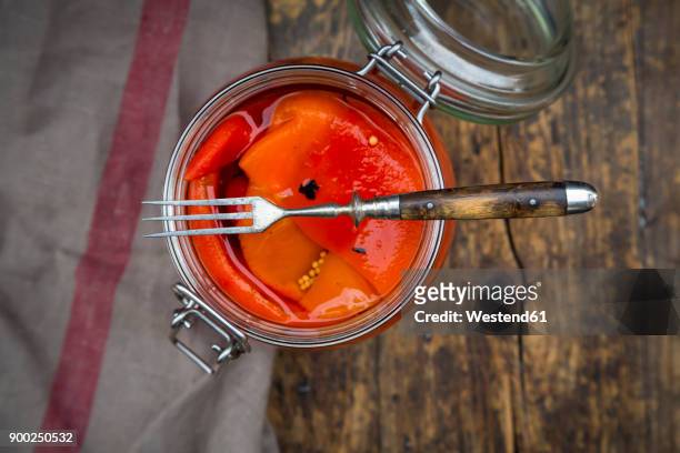 pickled roasted bell pepper, open preserving jar and fork - roasted pepper stock pictures, royalty-free photos & images