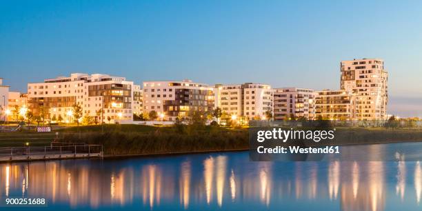 germany, sindelfingen, boeblingen flugfeld, view to development area at langer see at twilight - flugfeld stock pictures, royalty-free photos & images