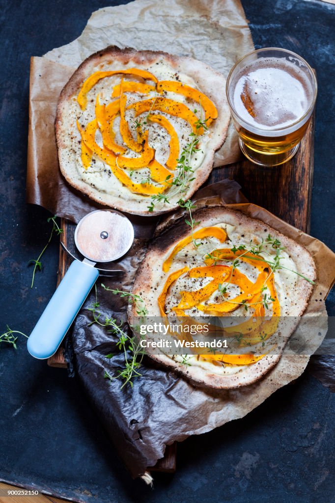 Tarte Flambee with soft goat cheese, pumpkin slices and fresh thyme
