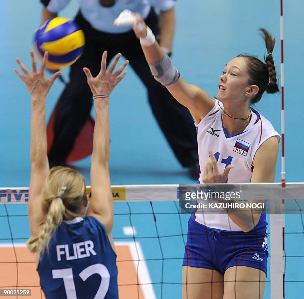 Russia's Ekaterina Gamova spikes the ball over Manon Flier of the Netherlands during a final round match of the World Grand Prix women's volleyball...