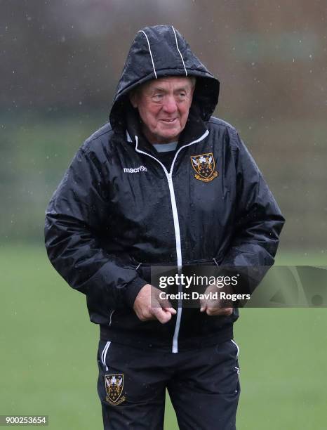 Alan Gaffney, the Northampton Saints technical coaching consultant, shelters from the rain during his first Northampton Saints training session held...