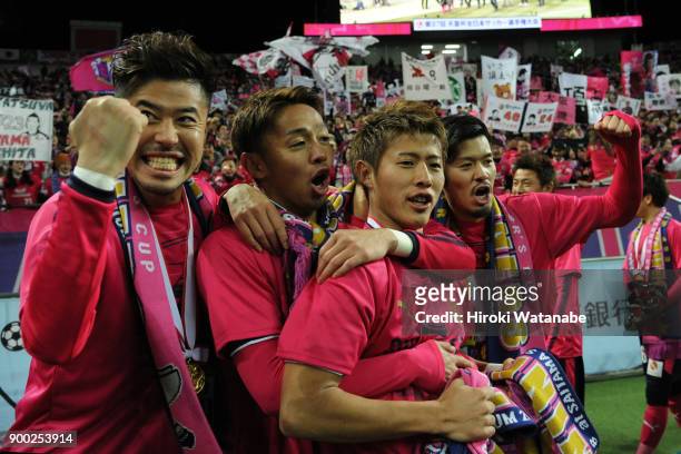 Hiroshi Kiyotake and Yuichiro Kakitani and Hotaru Yamaguchi of Cerezo Osaka gestures after the 97th All Japan Football Championship final between...