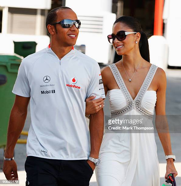 Lewis Hamilton of Great Britain and McLaren Mercedes and his girlfriend Nicole Scherzinger of the Pussycat Dolls walk in the paddock before the...