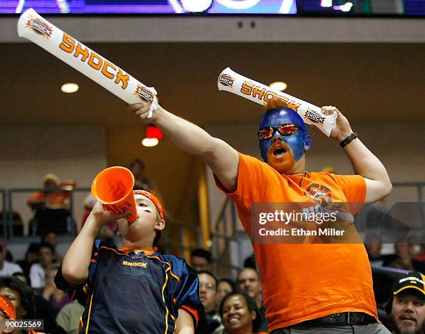 Spokane Shock fans Dakota Bauge and Dan Bauge of Wahington, celebrate after the Shock scored a touchdown against the Wilkes-Barre/Scranton Pioneers...