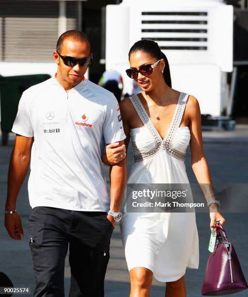 Lewis Hamilton of Great Britain and McLaren Mercedes and his girlfriend Nicole Scherzinger of the Pussycat Dolls walk in the paddock before the...