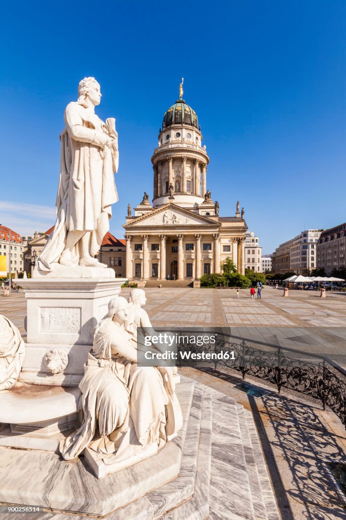 Germany, Berlin, Gendarmenmarkt, view to French Cathedral with statue of Friedrich Schiller in the foreground