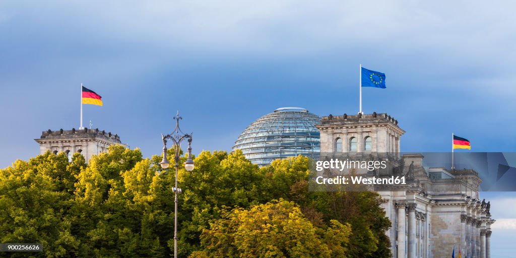 Germany, Berlin, Berlin-Tiergarten, Reichstag building with flags