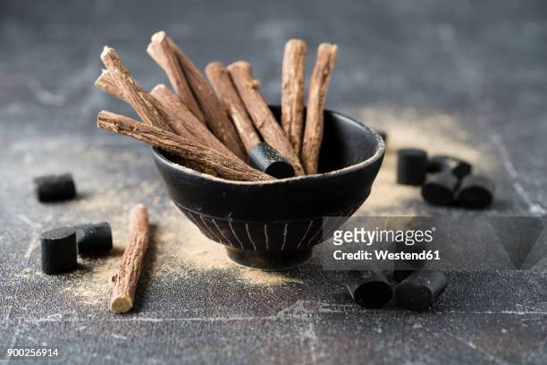licorice roots, licorice powder and licorice product - licorice stock pictures, royalty-free photos & images