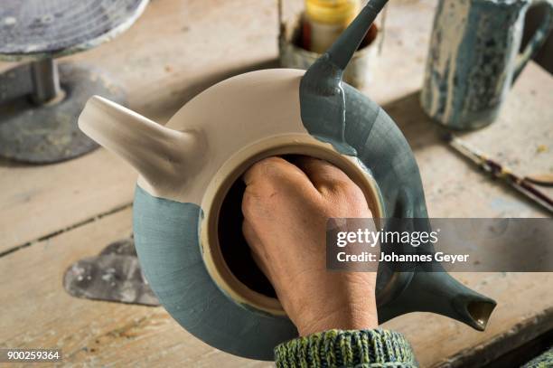 ceramic workshop, finished pot is painted blue, pittenhart, upper bavaria, germany - glazen pot stock pictures, royalty-free photos & images