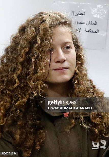 Sixteen-year-old Ahed Tamimi stands for a hearing in the military court at Ofer military prison in the West Bank village of Betunia on January 1,...