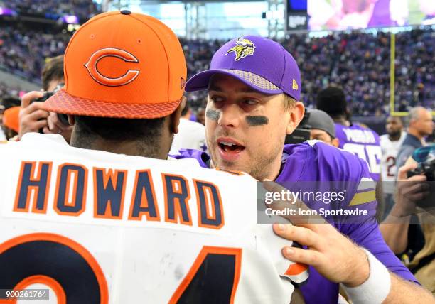 Minnesota Vikings quarterback Case Keenum chats with Chicago Bears Running Back Jordan Howard after a NFL game between the Minnesota Vikings and...