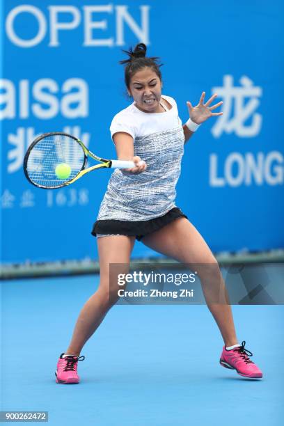 Zarina Diyas of Kazakhstan returns a shot during the match against Pauline Parmentier of France during Day 2 of 2018 WTA Shenzhen Open at Longgang...