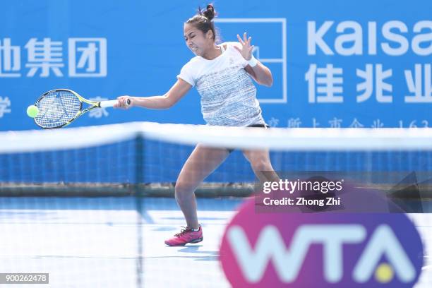 Zarina Diyas of Kazakhstan returns a shot during the match against Pauline Parmentier of France during Day 2 of 2018 WTA Shenzhen Open at Longgang...