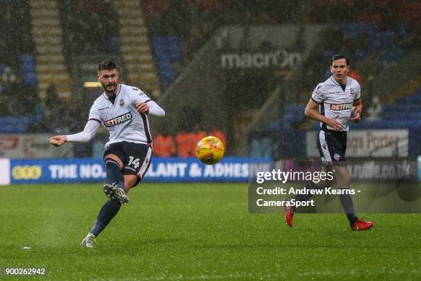 Bolton Wanderers' Gary Madine scores his side's first goal during the Sky Bet Championship match between Bolton Wanderers and Hull City at Macron...