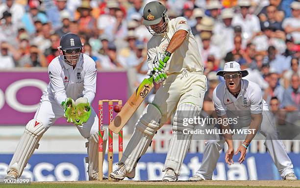 Australian batsman Ricky Ponting drives a ball away as England's Matt Prior and Andrew Strauss look on on the fourth day of the fifth and final Ashes...