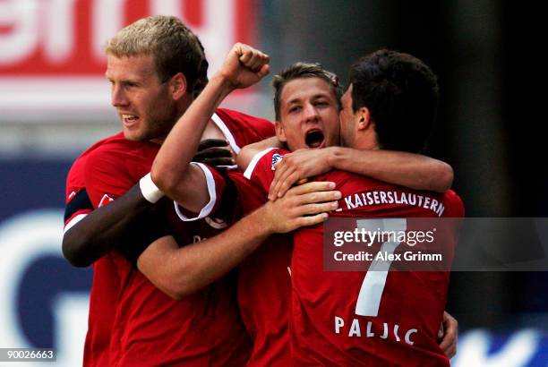 Ivo Ilicevic of Kaiserslautern celebrates his team's first goal with team mates Adam Nemec and Dragan Paljic during the 2. Bundesliga match between...