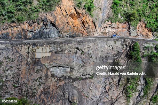 narrow street in cliff with trucks, death road, camino de la muerte, yungas road between la paz and coroico, bolivia - nuestra senora de la paz stock pictures, royalty-free photos & images