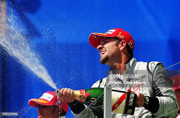 Rubens Barrichello of Brazil and Brawn GP celebrates on the podium after winning the European Formula One Grand Prix at the Valencia Street Circuit...