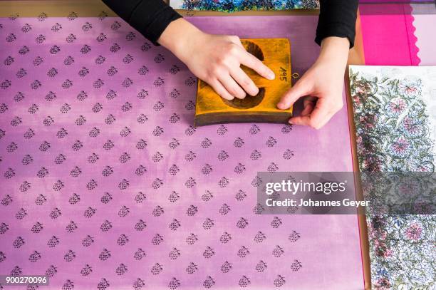 block printing, hands positioning woodblock with paint on fabric, bad aussee, styria, austria - bad aussee stock pictures, royalty-free photos & images