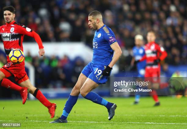 Islam Slimani of Leicester City scores his team's second goal during the Premier League match between Leicester City and Huddersfield Town at The...