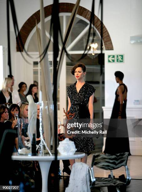 Model exhibits the latest creation of designer Kluk CDGT at the Arise Cape Town Fashion Week at the Val De Vie Winelands Lifestyle Estate on August...